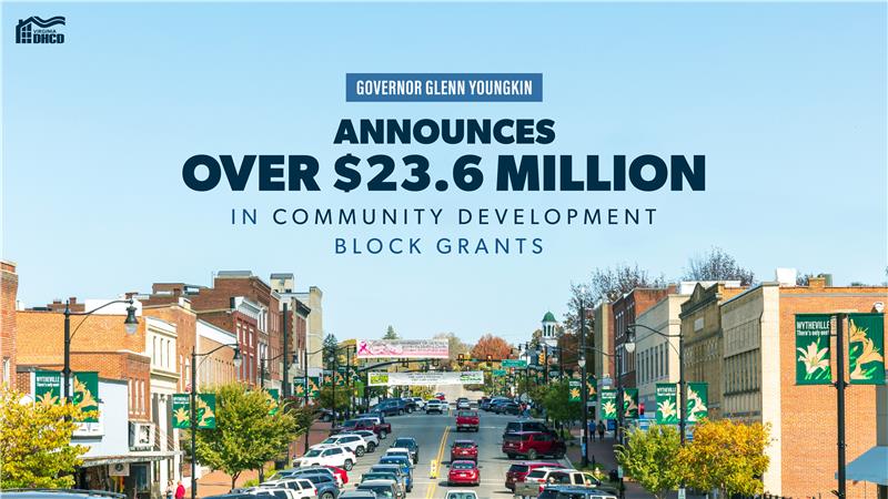 A street lined with brick shops and cars, with text reading "Governor Glenn Youngkin announces over $23.6 million in Community Development Block Grants