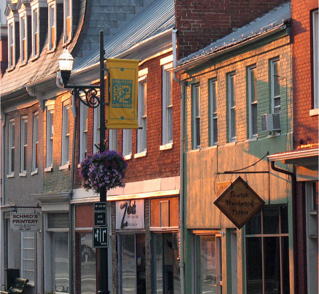 Different brick storefronts along a main street